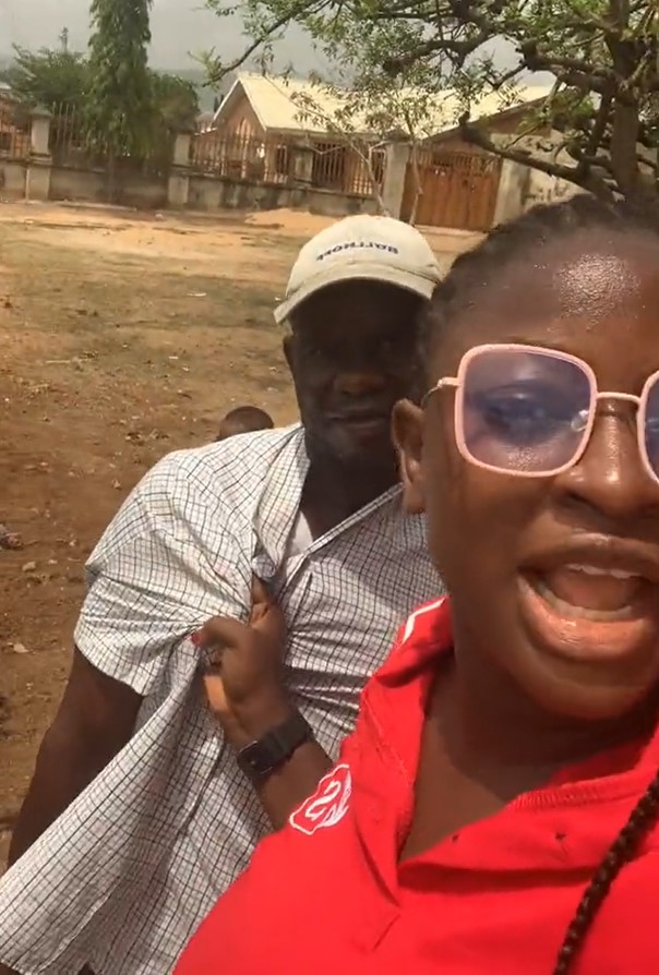 "Na person papa you hold like that" - Netizens react as lady confronts NEPA staff who came to disconnect their light when no one was home