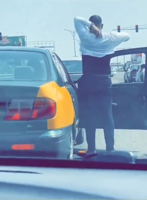 "This heat is beyond imagination"- Shocking moment a white man removed his shirt on the road due to the extreme heat in Ghana (Watch)