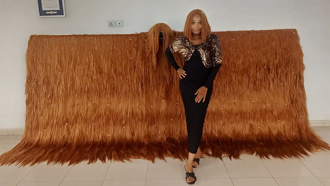 Nigerian Entrepreneur Hallen Williams Sets World Record for Widest Wig