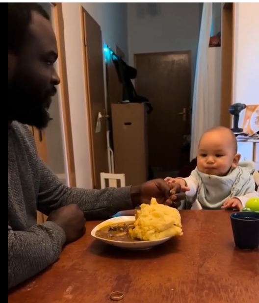 Netizens roar with laughter as a white baby rushes his dad to feed him Nigerian food