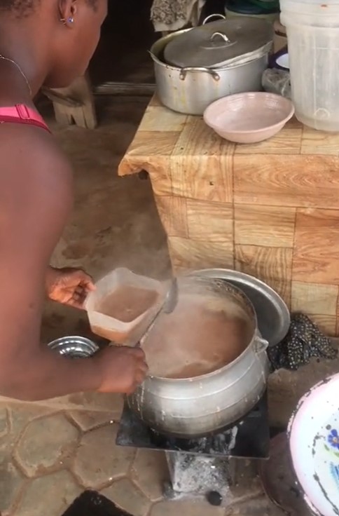 Nigerian man sparks reaction as he buys N50 beans and N200 beans water from a street food vendor (VIDEO)