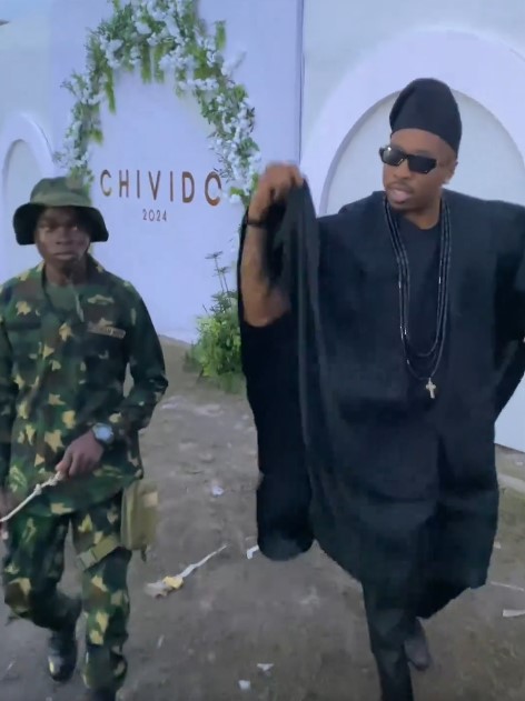 "Is that a real cadet behind Ike?" – Moment Reality TV star, Ike arrived at Davido's wedding with a solider (VIDEO)