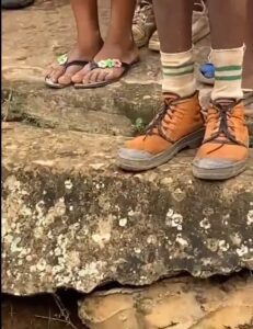 "Abeg leave am na inheritance" – Reaction as young boy, rocks NYSC boots to school (VIDEO)