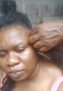 "Husband of the year" – UK based Nigerian lady shares how she saved £200 as her husband braids her hair (VIDEO)