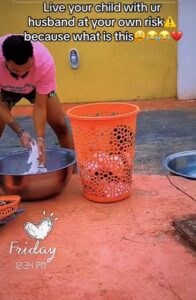 "The baby’s name must be Moses" – Nigerian woman stúnned as husband places their toddler inside the laundry basket while washing (WATCH)