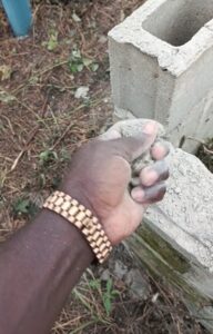 Nigerian man marvels at the striking 'miracle' made by a block used in laying the foundation of his building (WATCH)