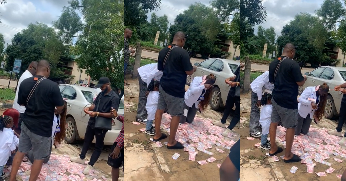 Video Of Men Showering Cash On A Lady As She Signs Out Goes Viral (WATCH)